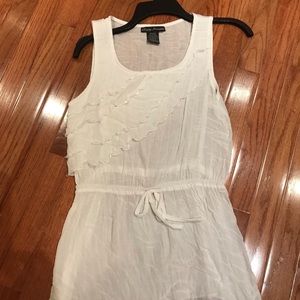 Sleeveless cream top.